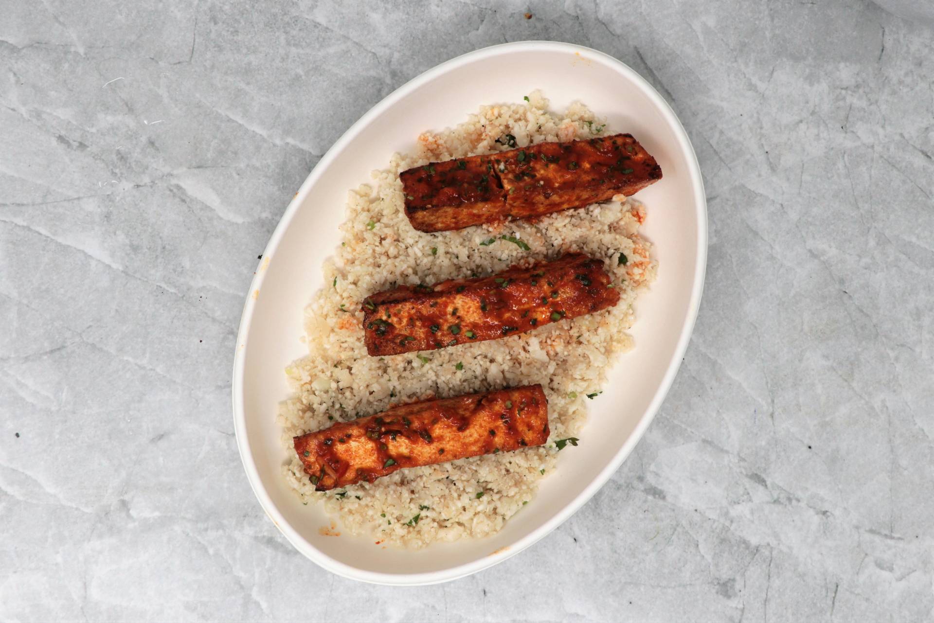 Harissa tofu skewers with cauliflower pilaf